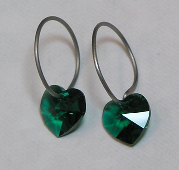 titanium sleeper earrings with green swarovski heart beads
